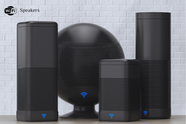 Four sleek black Wi-Fi speakers of varying sizes with blue Wi-Fi symbols