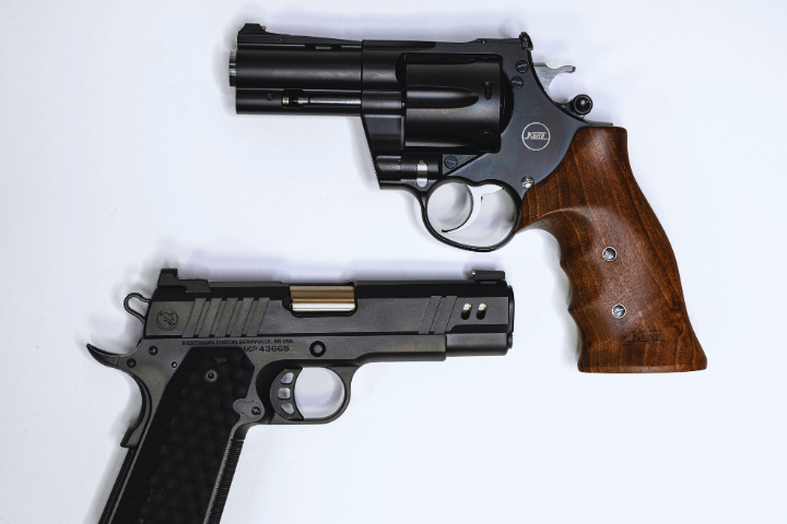 Two firearms are displayed against a white background
